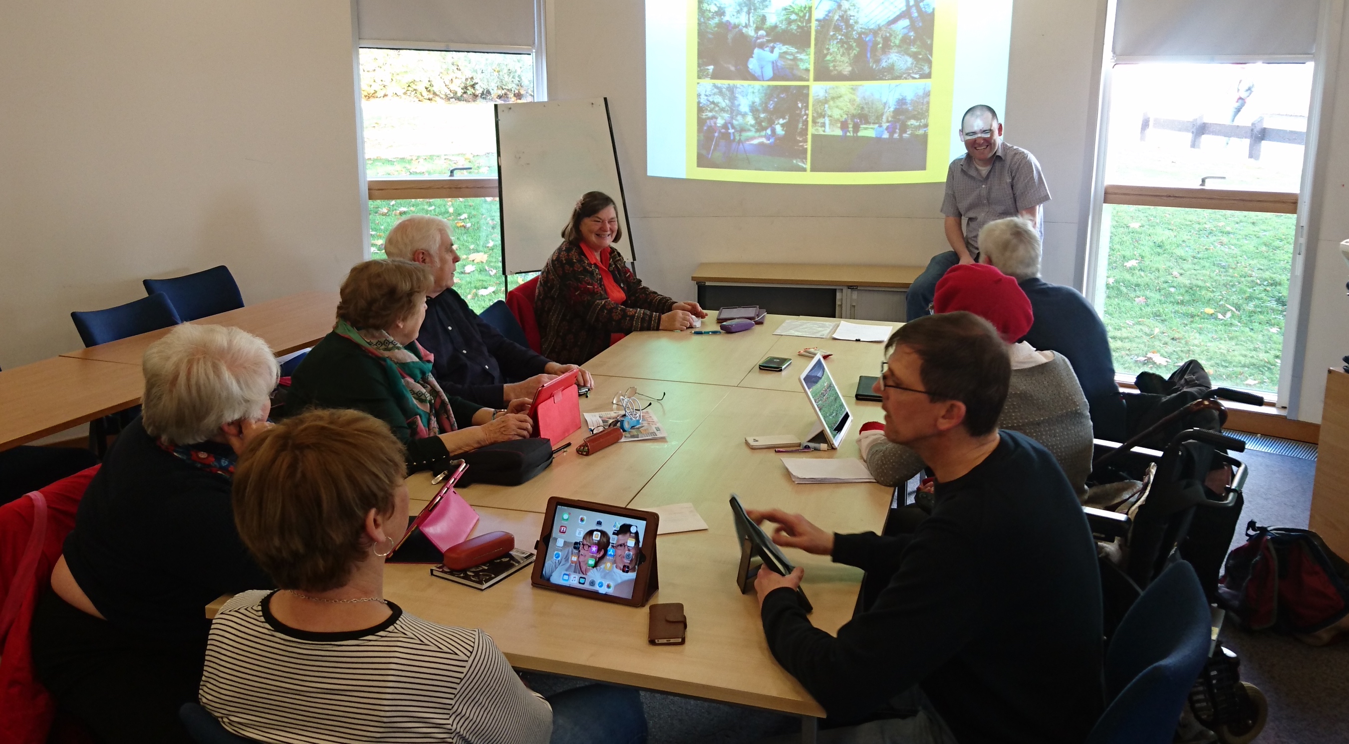 The Tap and Talk group at work around a table at the University