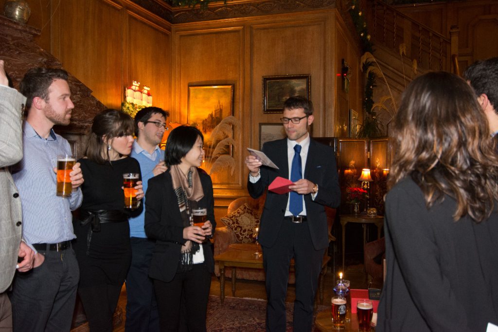 Alessio reading a card at Christmas party 2014
