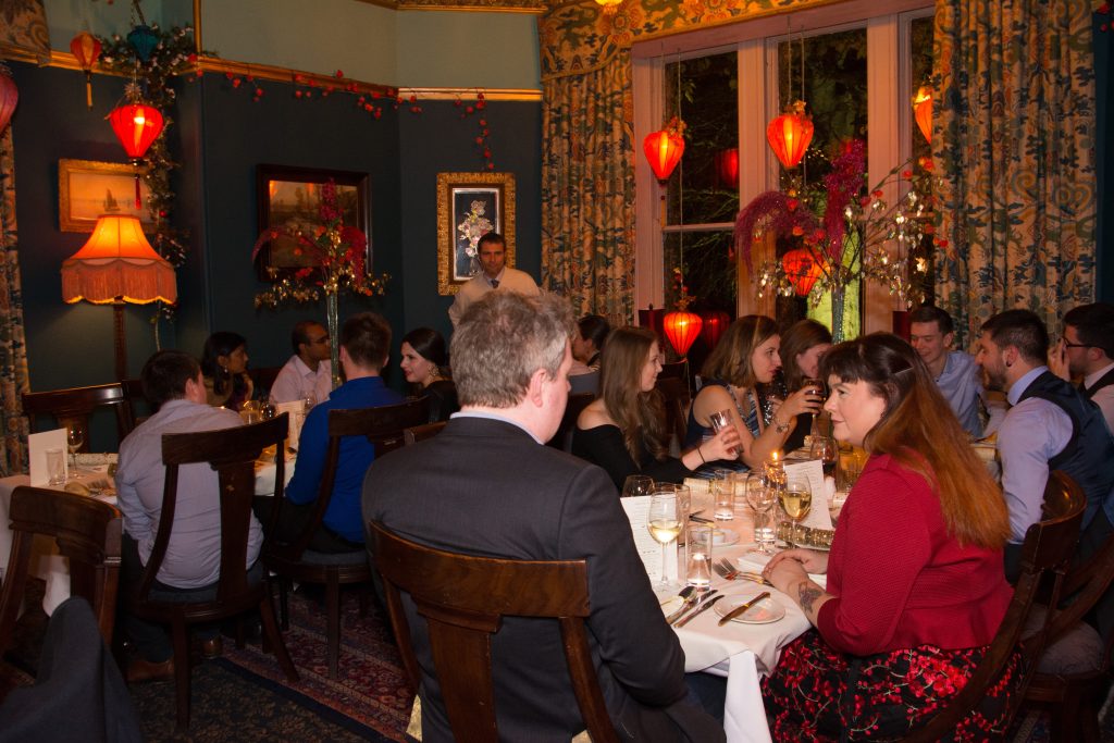 Christmas party 2018 with several groups sitting at tables