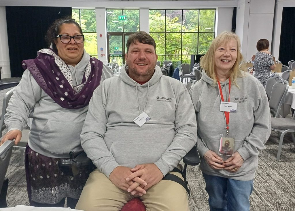 Kausar, Antony and Irene wearing their Alleviate hoodies