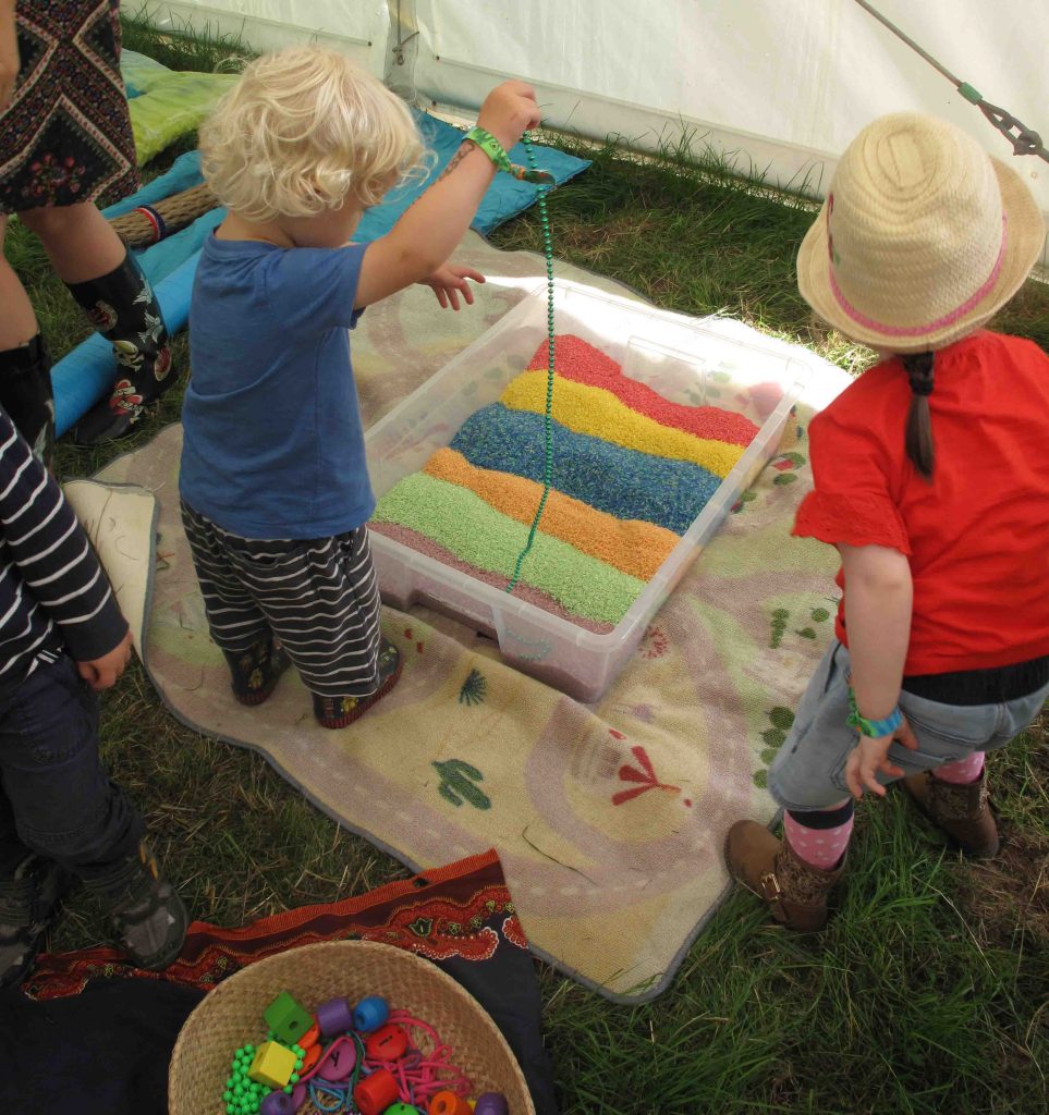 Rainbow rice sensory tray – Art at the Start