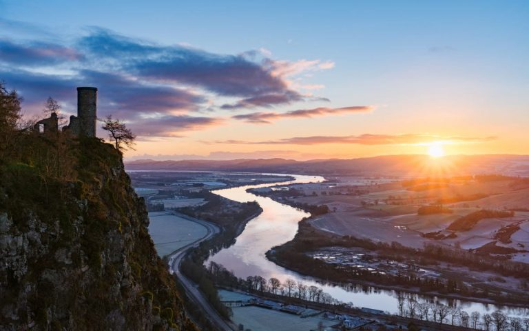 Hill, river and sunset