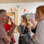 Student with flowers during opening night