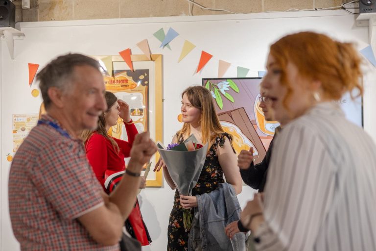 Student with flowers during opening night