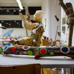 Student project work on table, painted tree and handmade mannequin