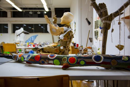 Student project work on table, painted tree and handmade mannequin