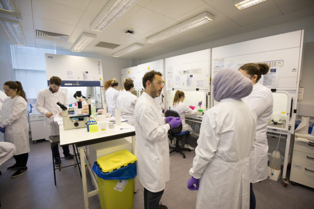 People chatting in a lab